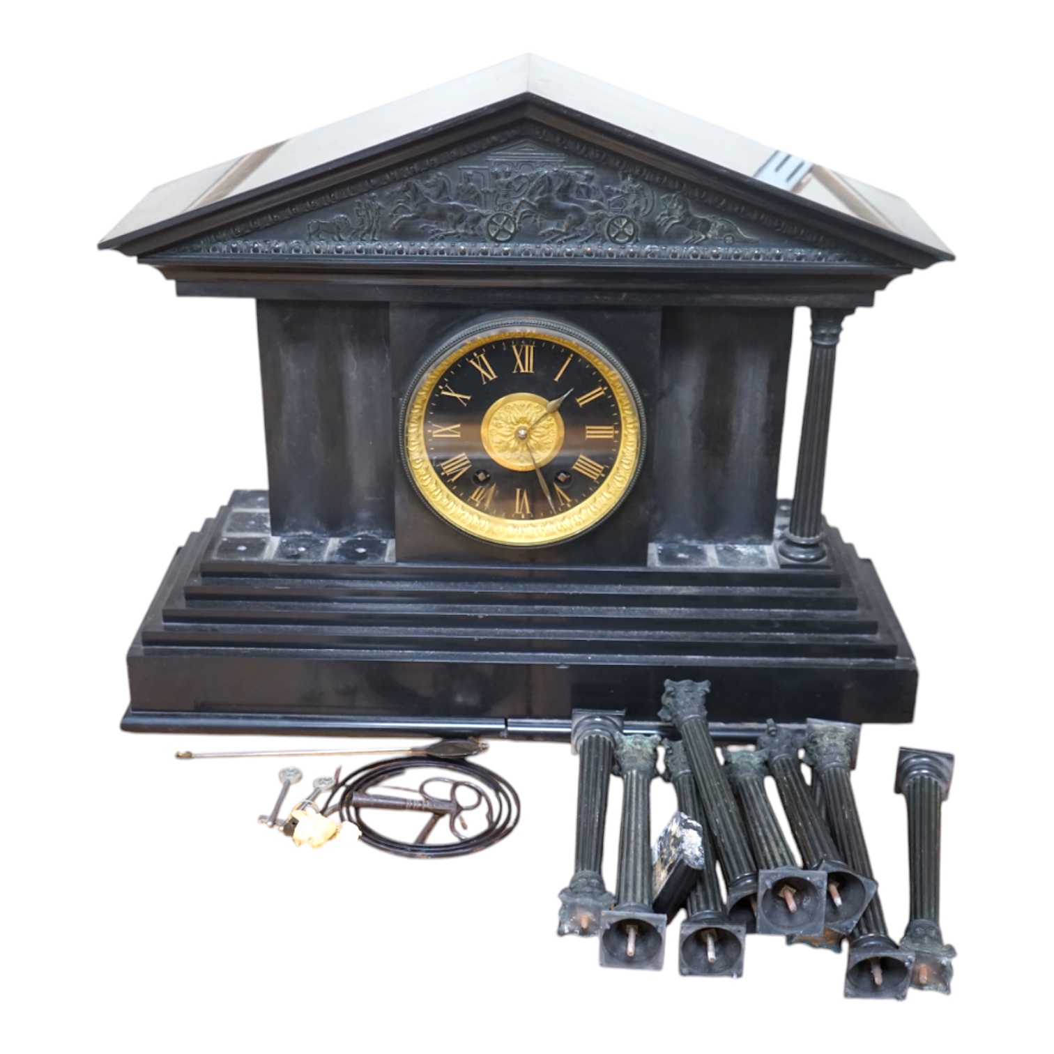 A Victorian black slate mantel clock, 54.5cm wide. Condition - columns and some clock parts loose